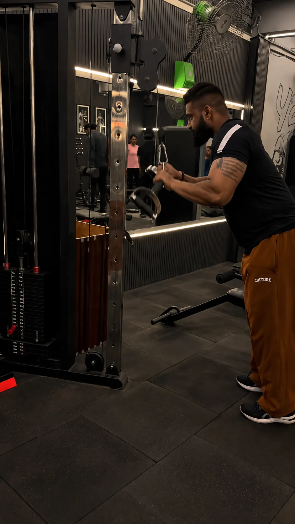 Working at the cable station at POL Fitness